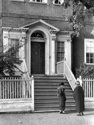 Two Women Stand at the Foot of the Entrance to the Chase House